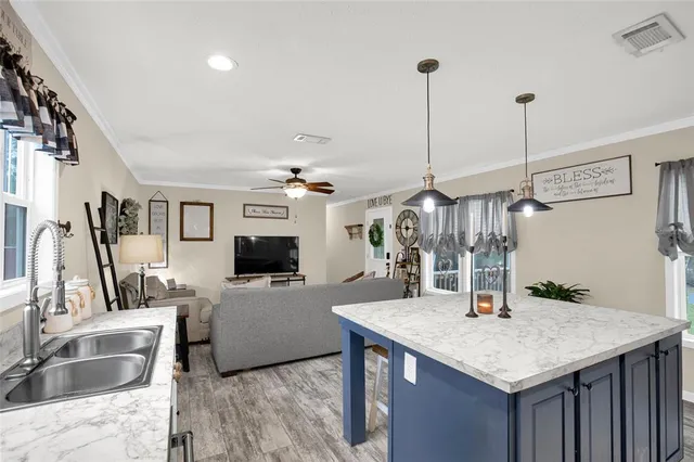 a kitchen with sink cabinets and refrigerator