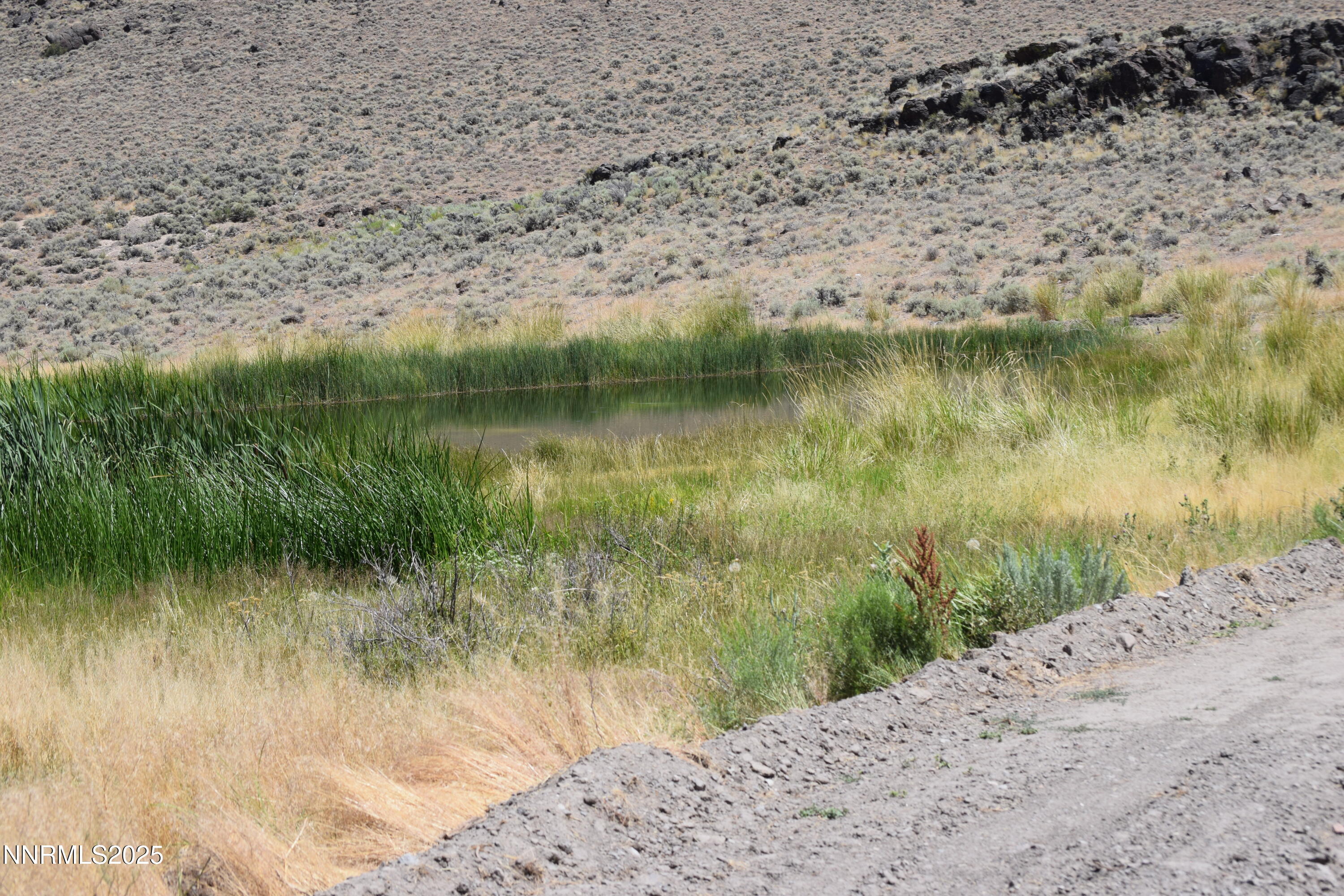 3306 High Rock Road Reno, NV 89510 - Photo 22 of 43 a view of a lake with a mountain in the background