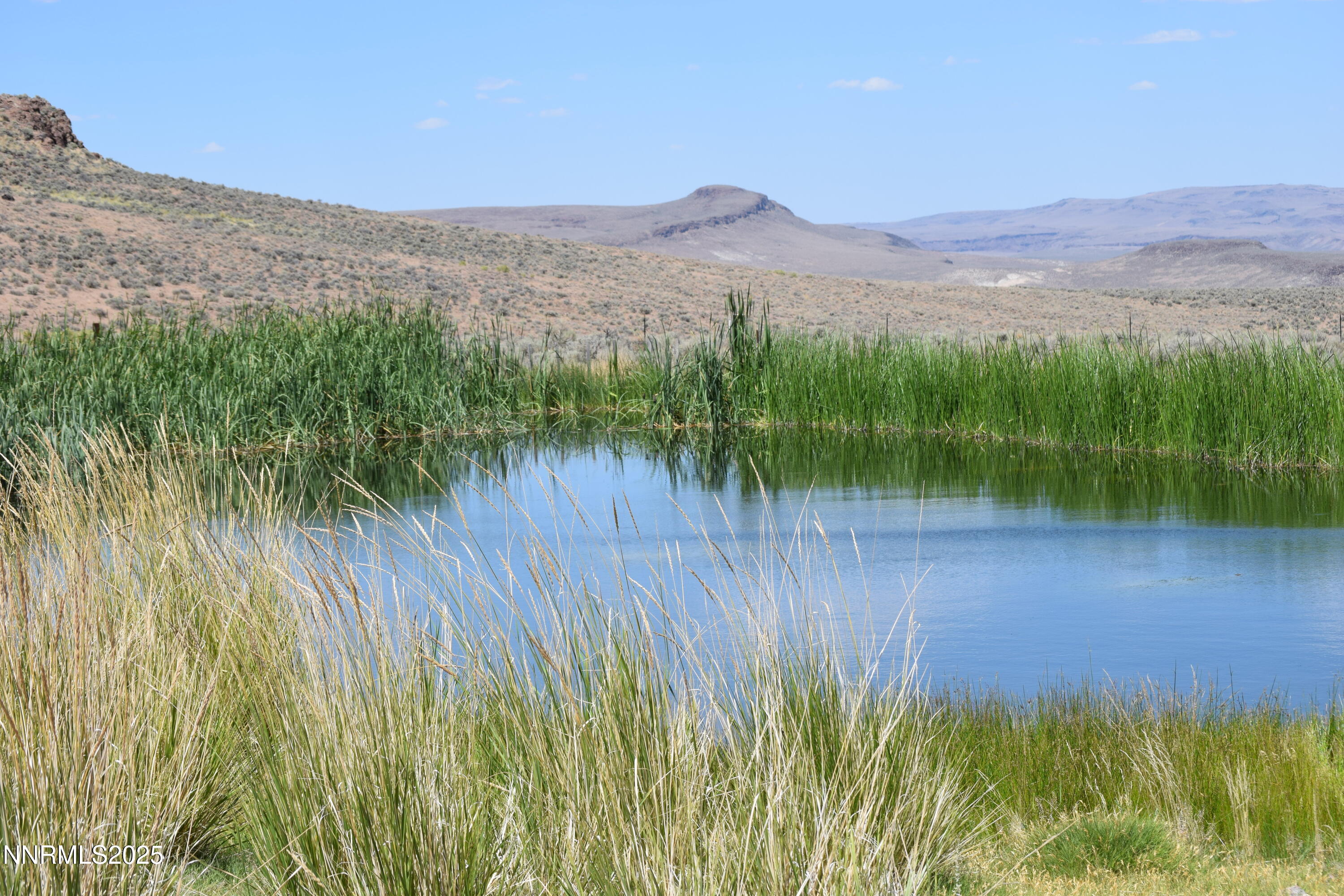 3306 High Rock Road Reno, NV 89510 - Photo 29 of 43 a view of a lake with a mountain in the background
