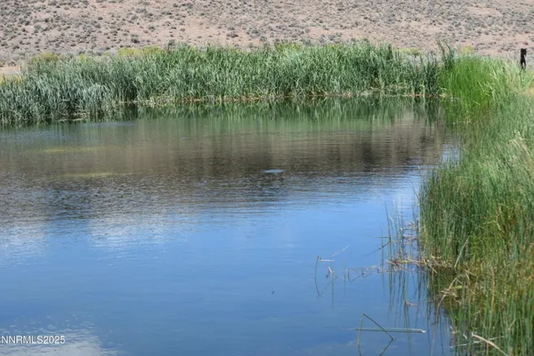 a view of lake with mountain