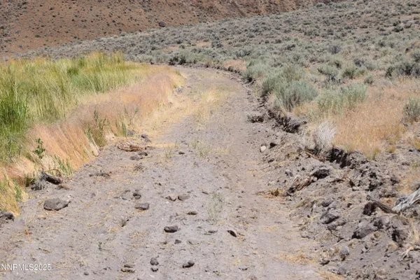 a sign board with a lake view