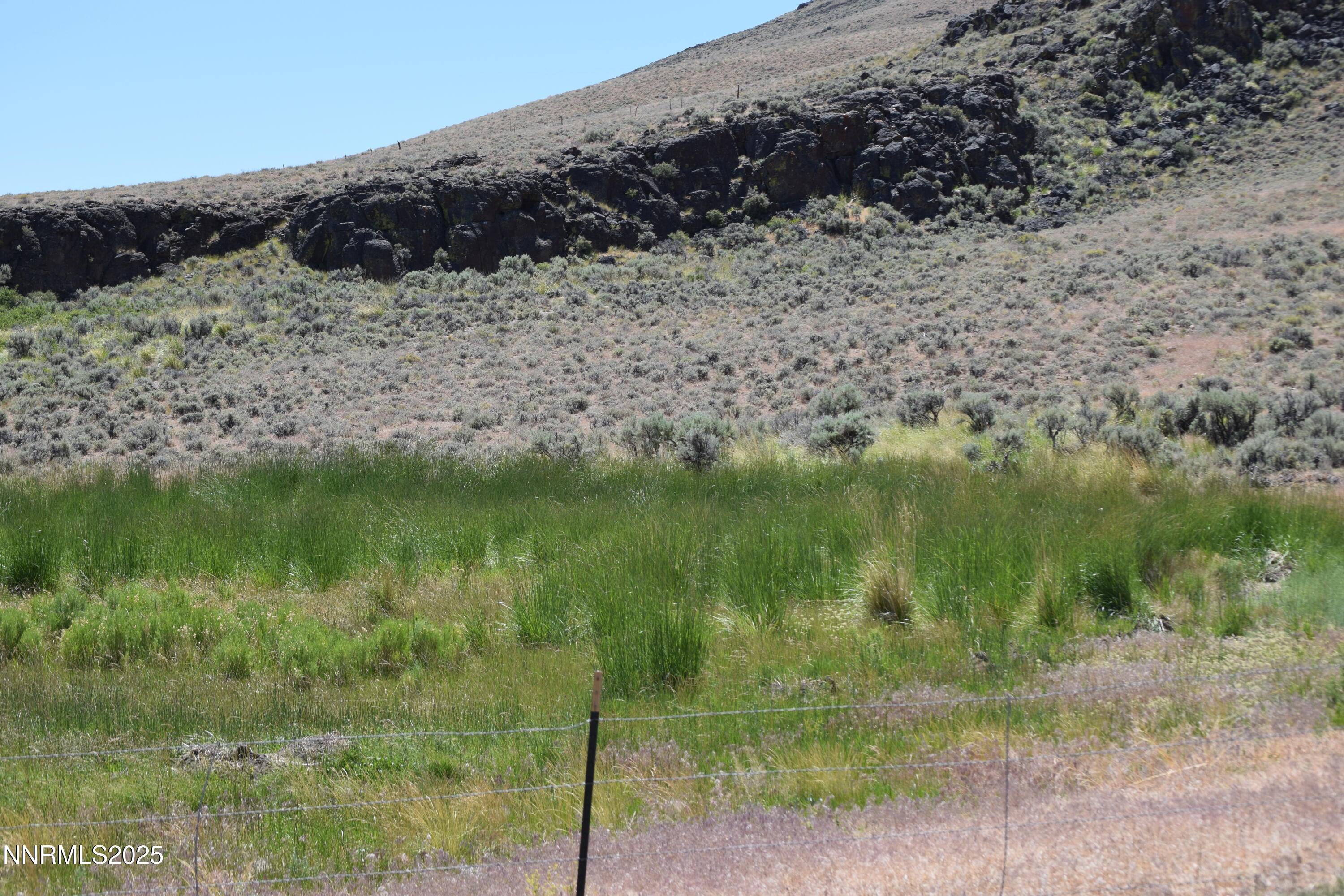 3306 High Rock Road Reno, NV 89510 - Photo 6 of 43 a view of a lake from a yard