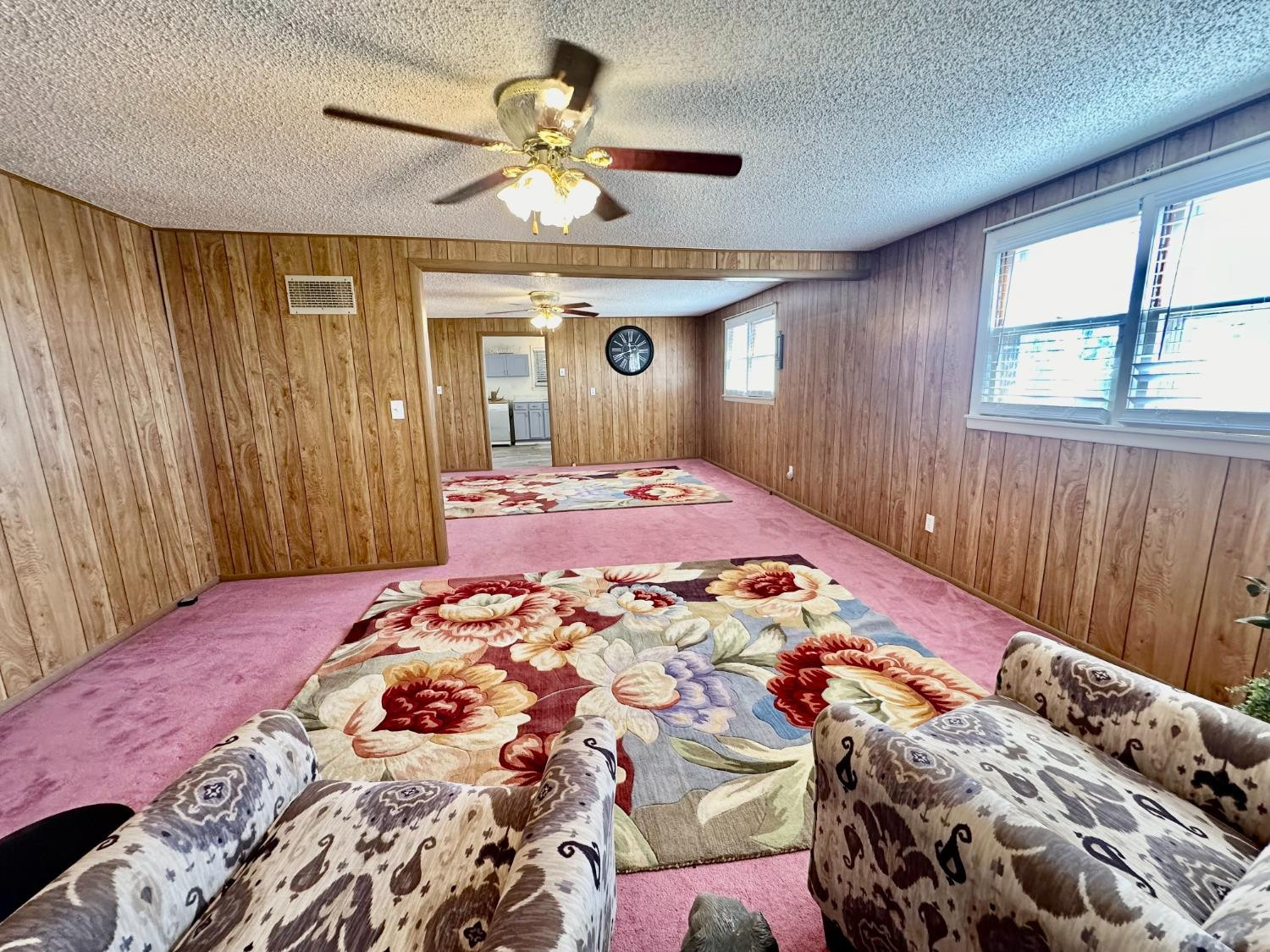 615 Highway 84 Friona, TX 79035 - Photo 14 of 41 a bedroom with a large bed and a chandelier