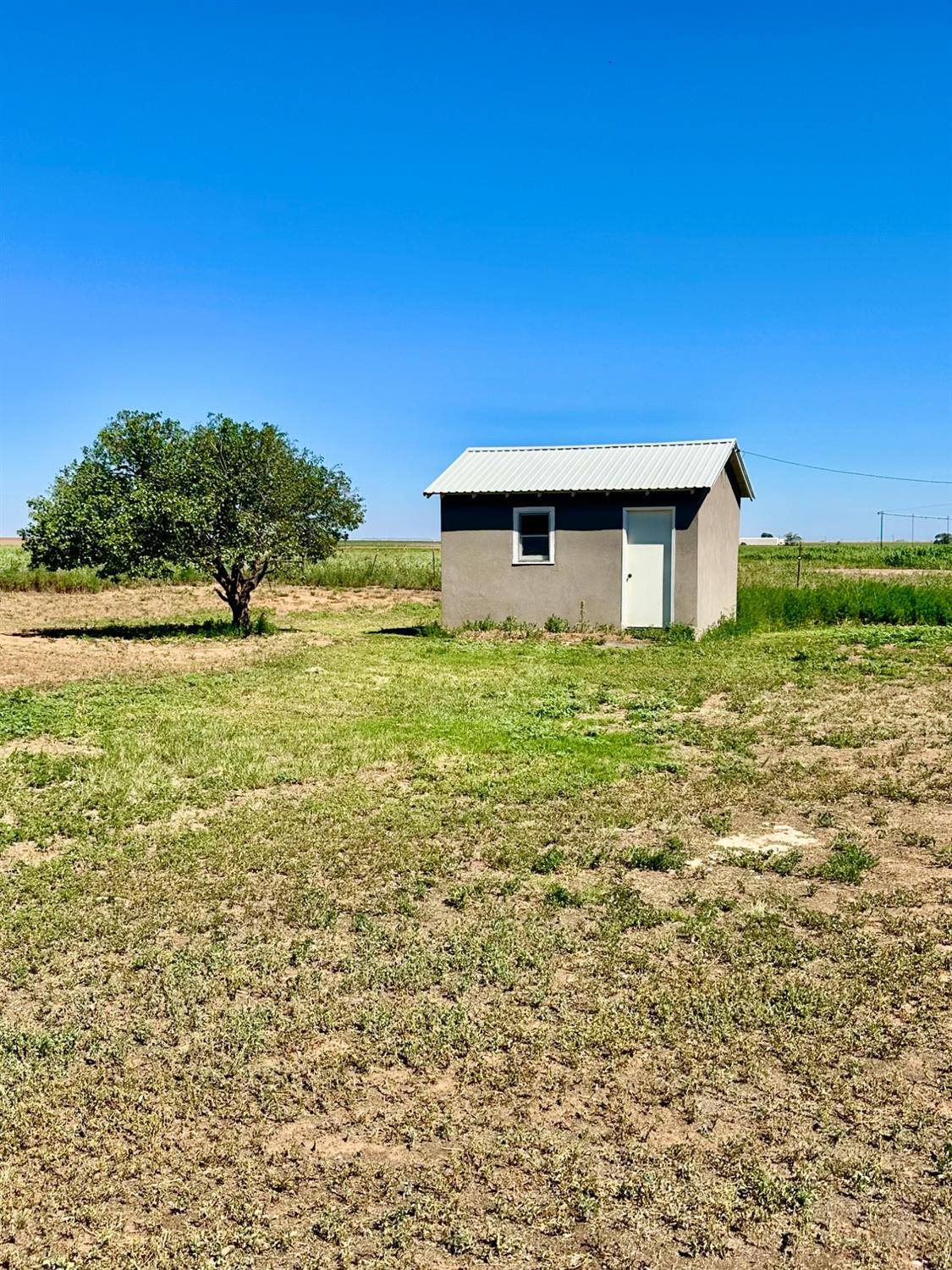 615 Highway 84 Friona, TX 79035 - Photo 27 of 41 a house with yard in front of it
