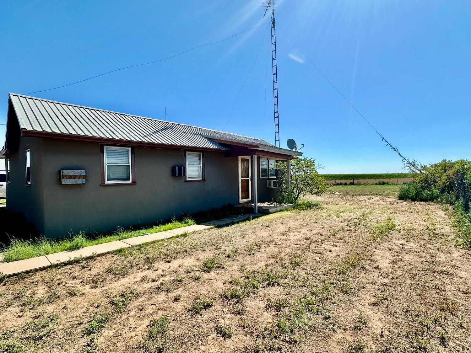 615 Highway 84 Friona, TX 79035 - Photo 3 of 41 a house with trees in the background
