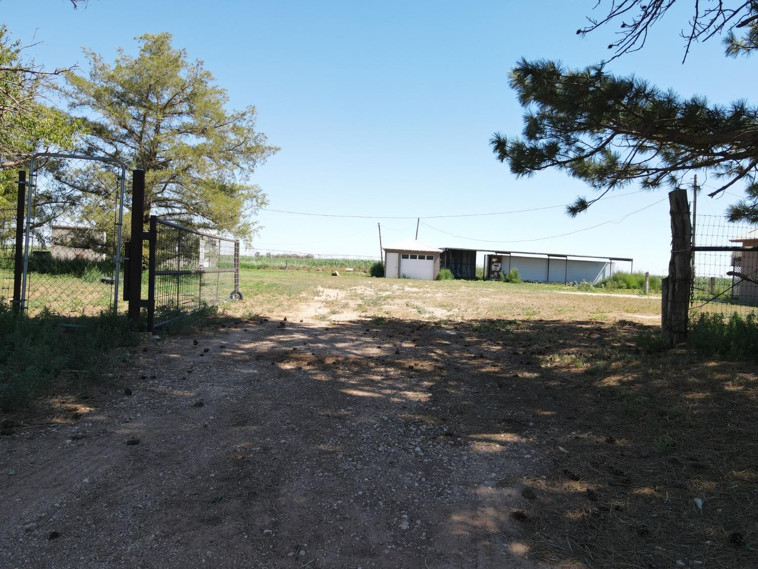 615 Highway 84 Friona, TX 79035 - Photo 41 of 41 a view of a yard with wooden fence
