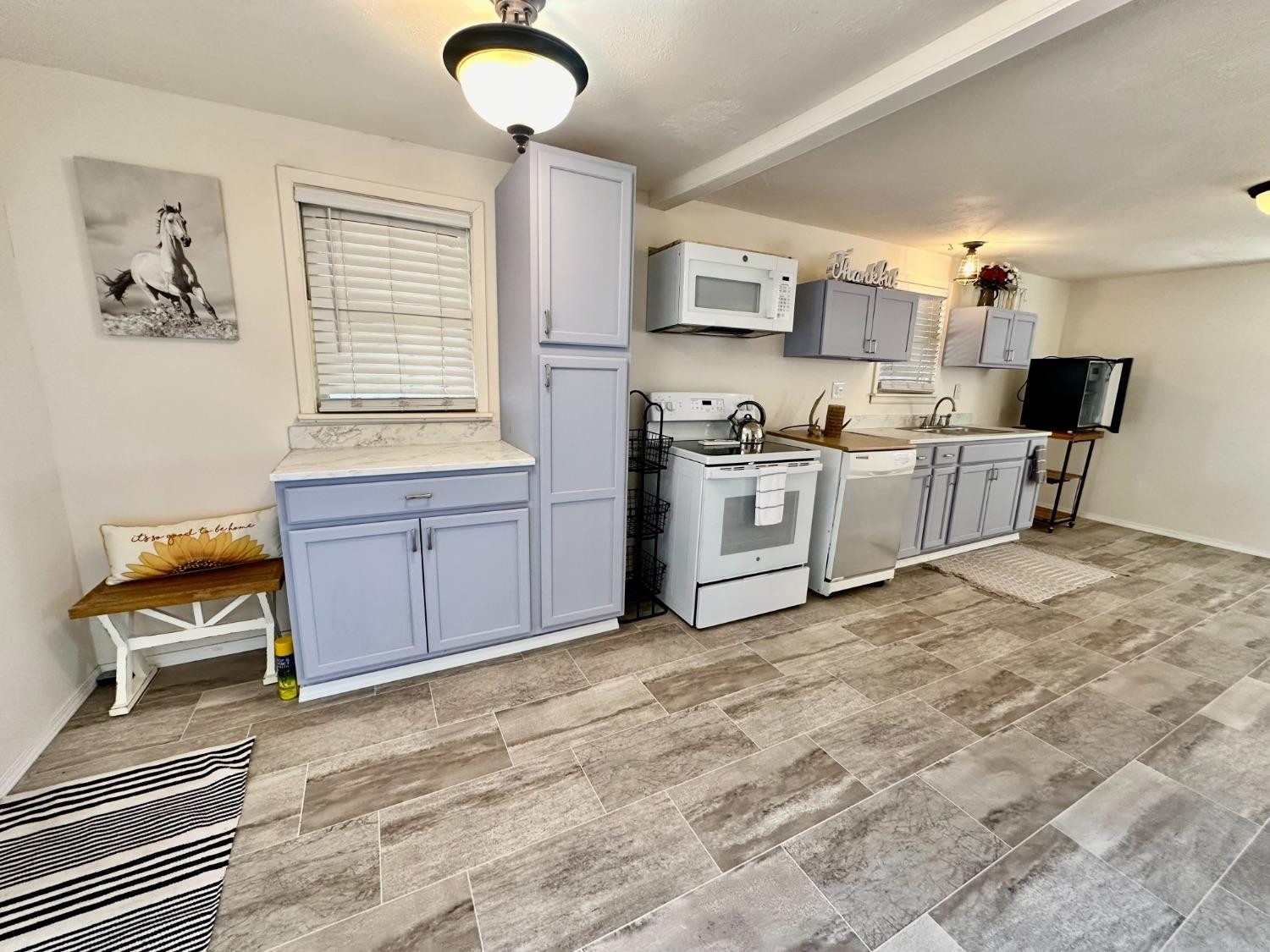 615 Highway 84 Friona, TX 79035 - Photo 7 of 41 a kitchen with stainless steel appliances granite countertop a stove a sink dishwasher and a refrigerator