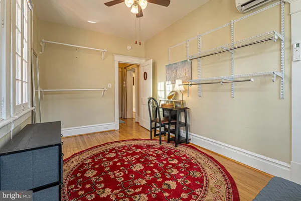 a bedroom with bed and a table