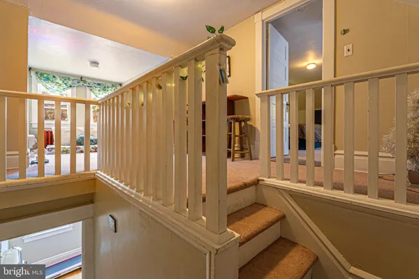 a balcony with table and chairs