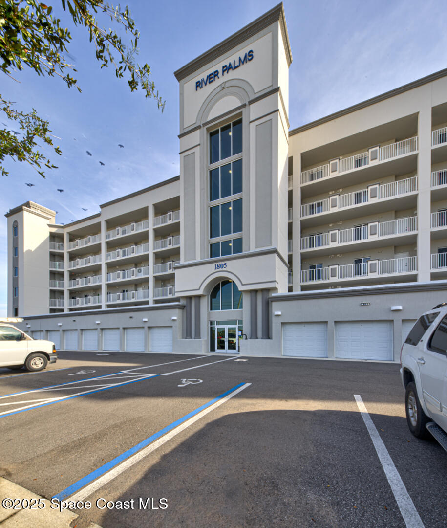 a front view of a building with a road