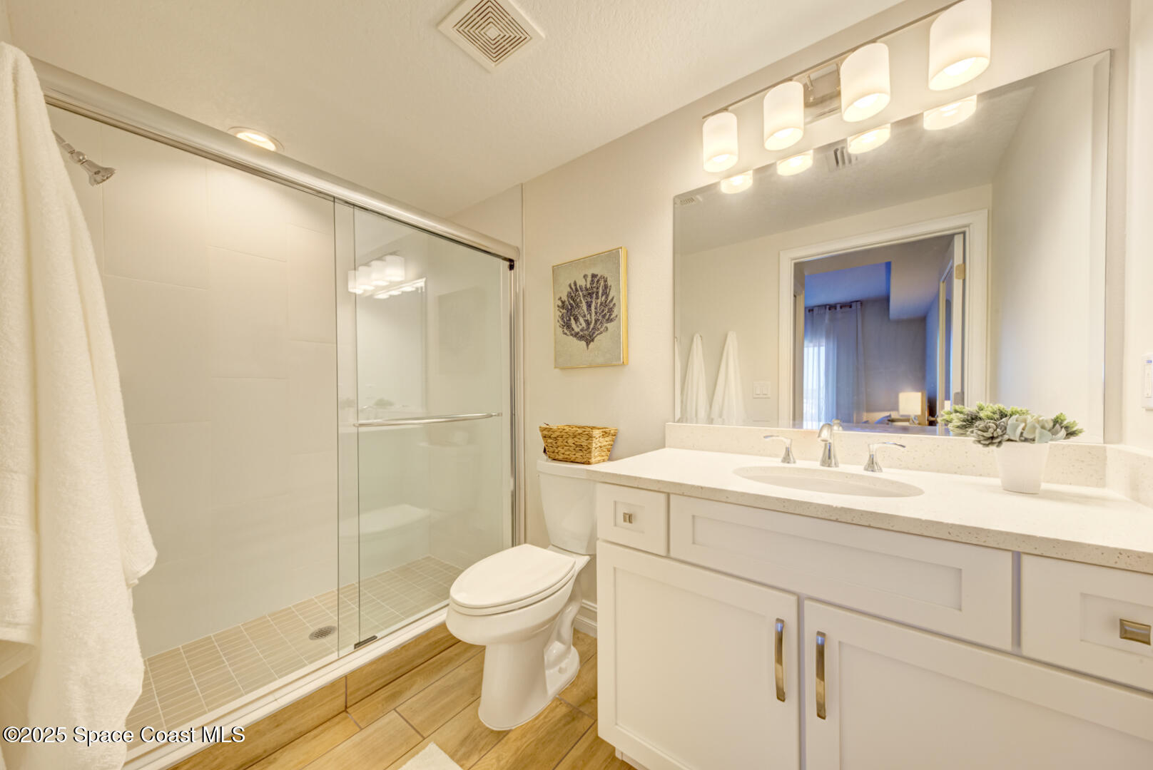 1805 Riverside Drive, Unit 504 Titusville, FL 32780 - Photo 11 of 48 a bathroom with a sink and a mirror with toilet