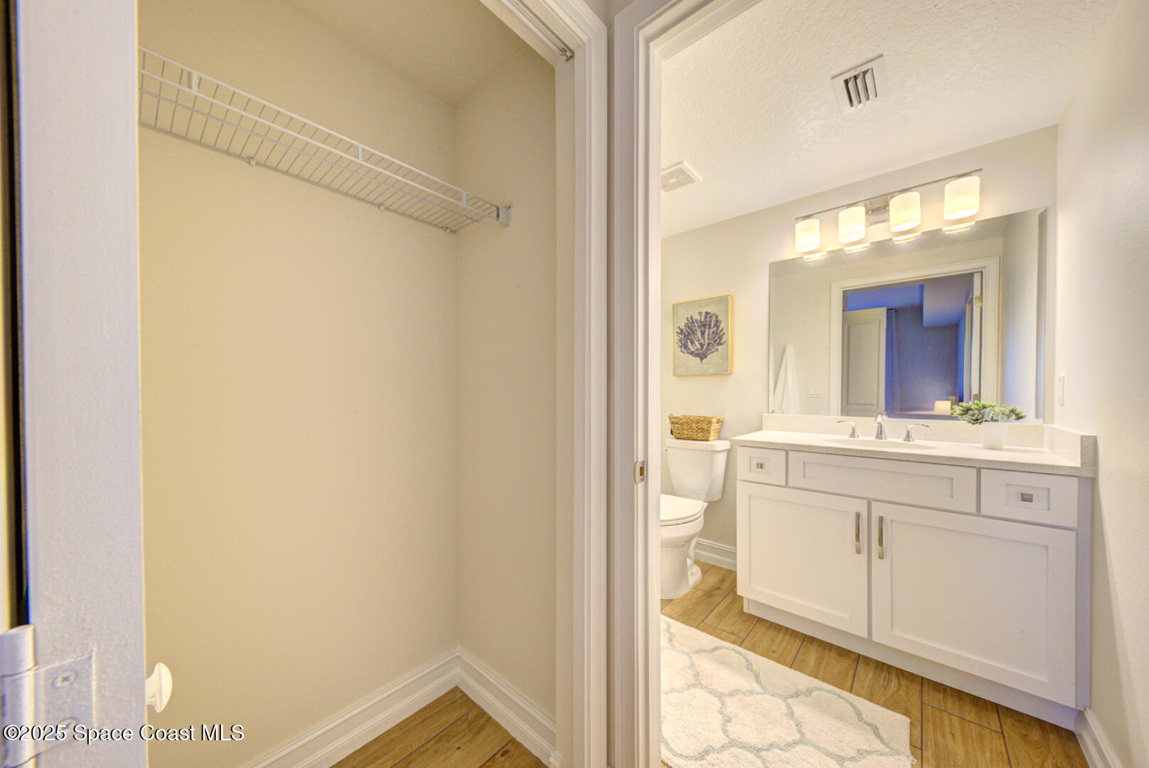 1805 Riverside Drive, Unit 504 Titusville, FL 32780 - Photo 13 of 48 a bathroom with a sink mirror and a shower