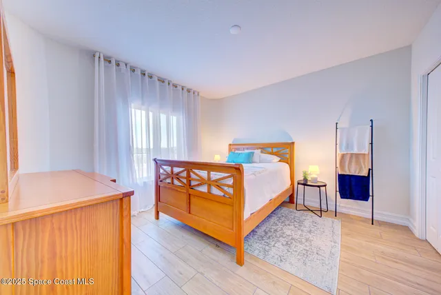 a bedroom with a bed and a table in it