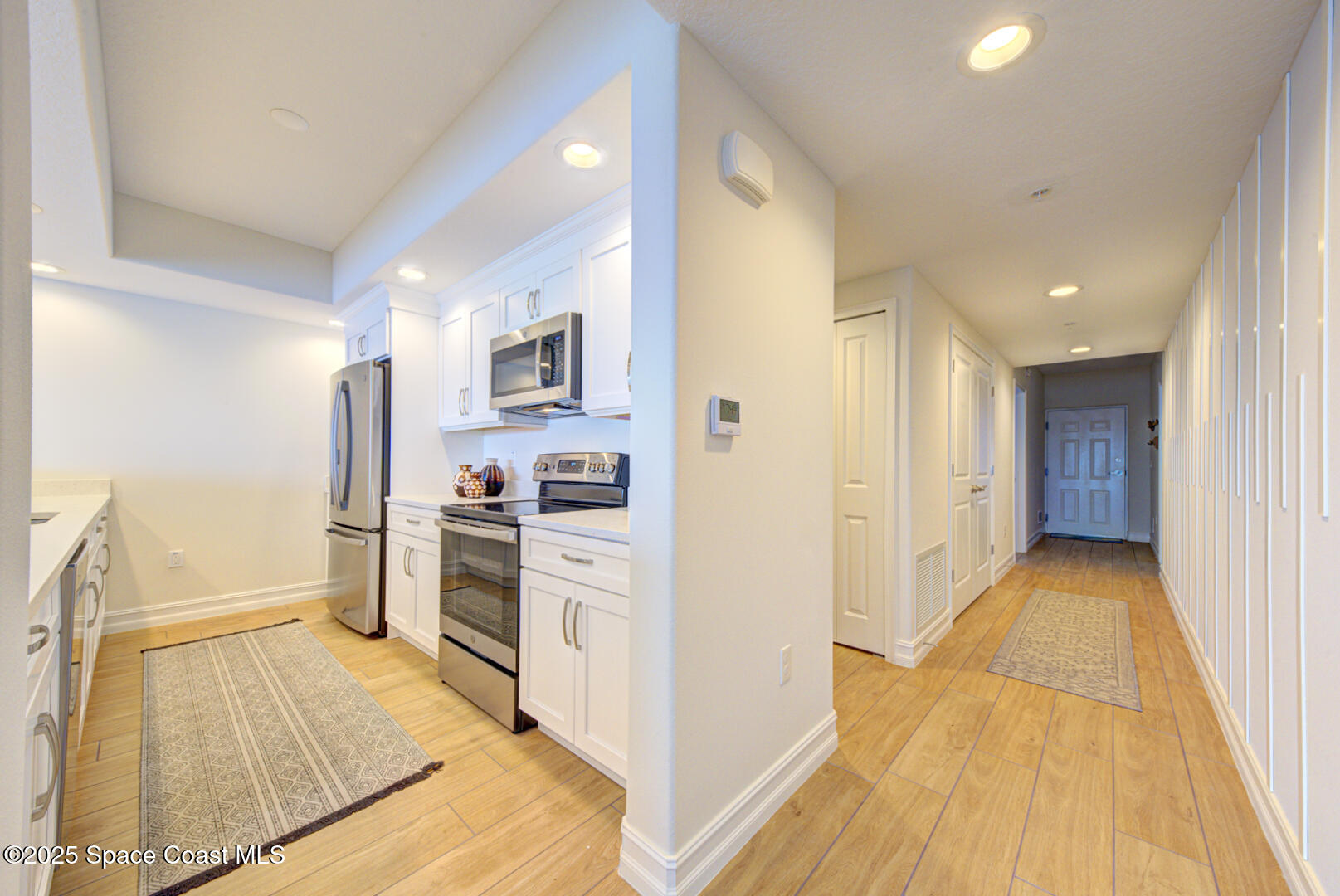1805 Riverside Drive, Unit 504 Titusville, FL 32780 - Photo 22 of 48 a view of a kitchen from the hallway