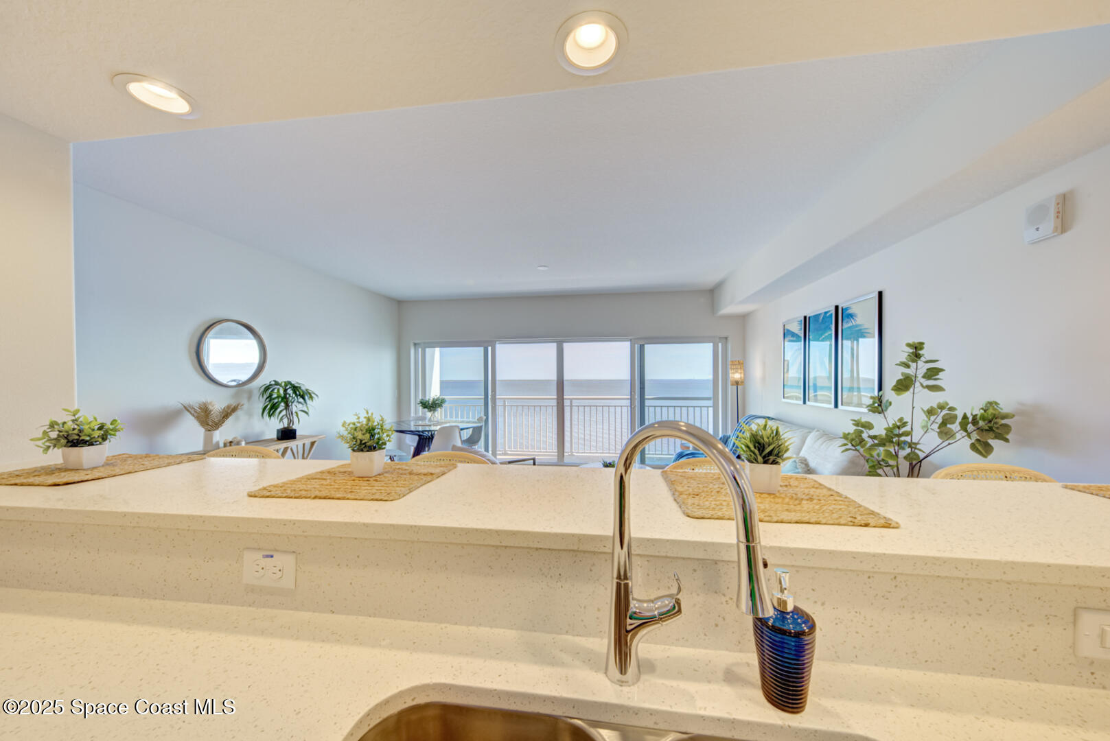 1805 Riverside Drive, Unit 504 Titusville, FL 32780 - Photo 27 of 48 a bedroom with a bed and a chandelier