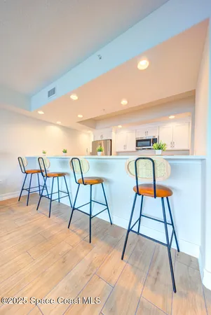 a dining room with a table and chairs