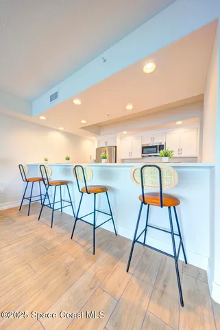 a dining room with a table and chairs