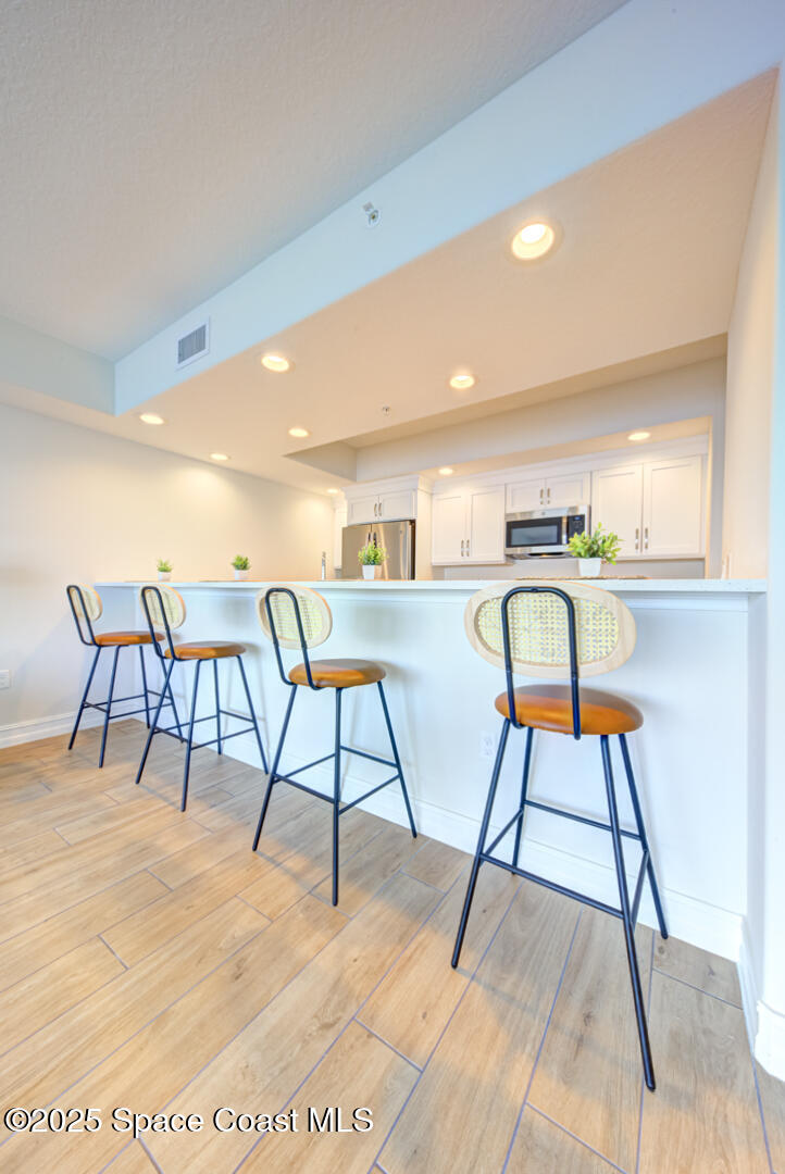 1805 Riverside Drive, Unit 504 Titusville, FL 32780 - Photo 28 of 48 a dining room with a table and chairs