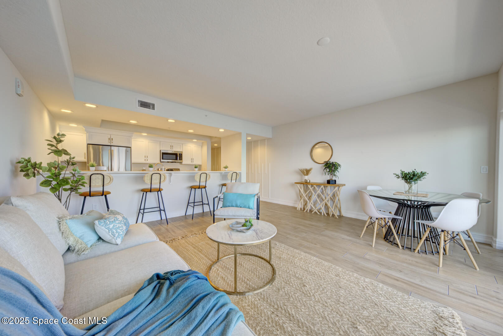 1805 Riverside Drive, Unit 504 Titusville, FL 32780 - Photo 29 of 48 a living room with furniture and a table