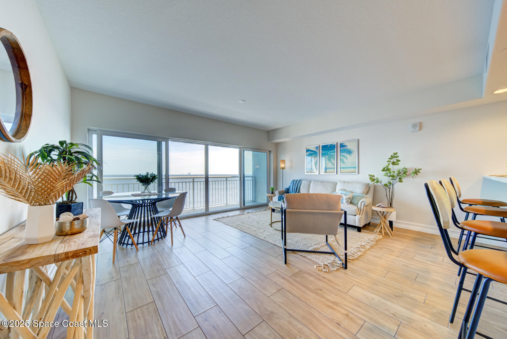 1805 Riverside Drive, Unit 504 Titusville, FL 32780 - Photo 30 of 48 a living room with furniture a table and wooden floor