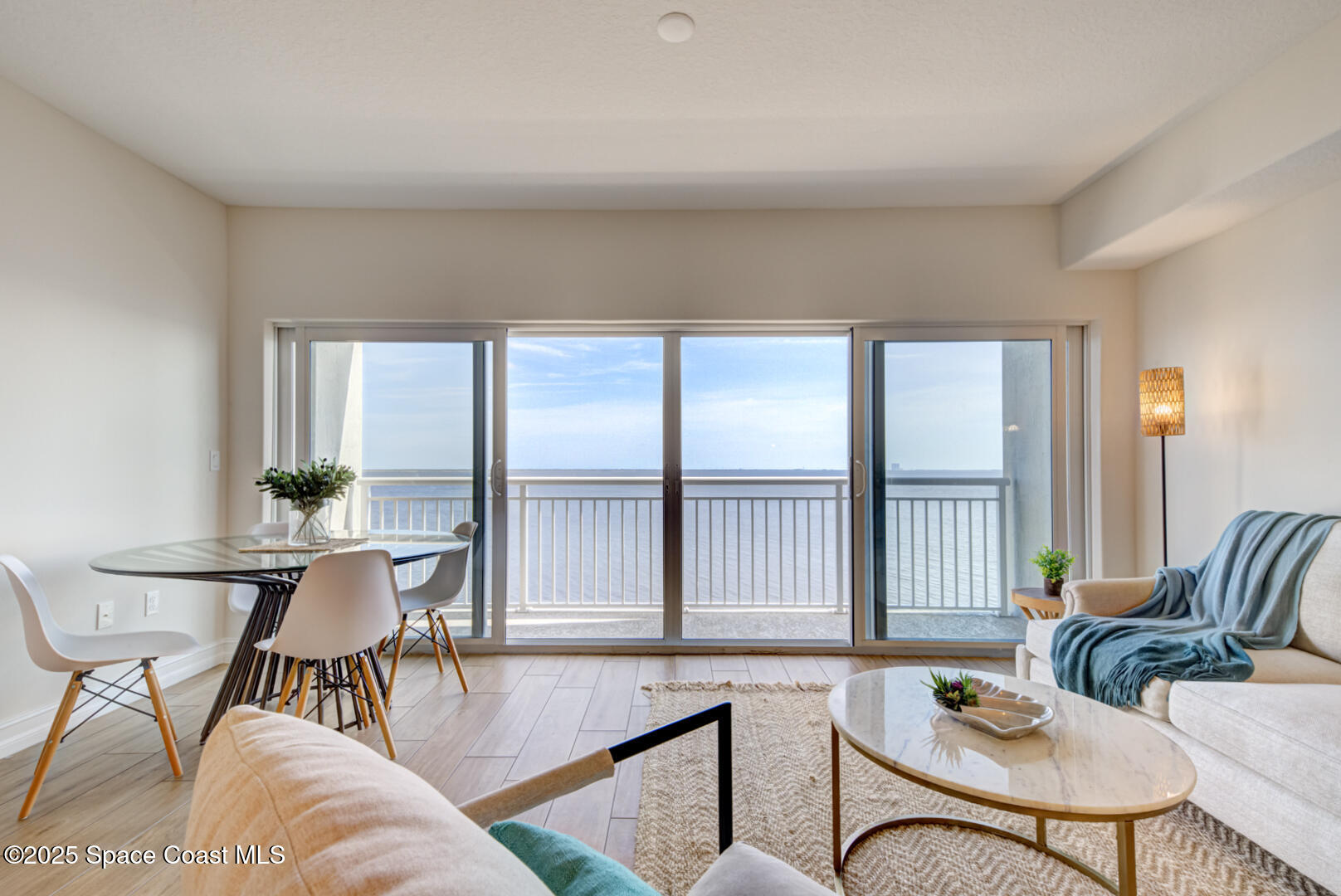 1805 Riverside Drive, Unit 504 Titusville, FL 32780 - Photo 32 of 48 a living room with furniture and a large window