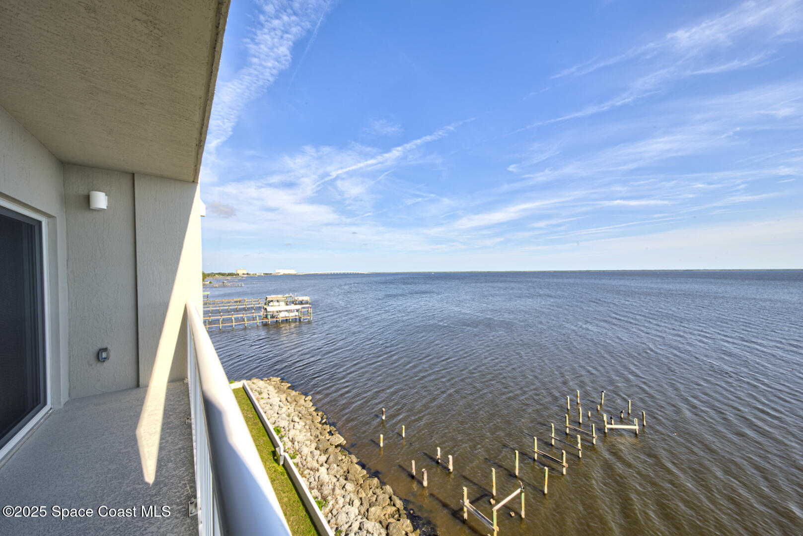 1805 Riverside Drive, Unit 504 Titusville, FL 32780 - Photo 35 of 48 a view of a balcony with wooden floor