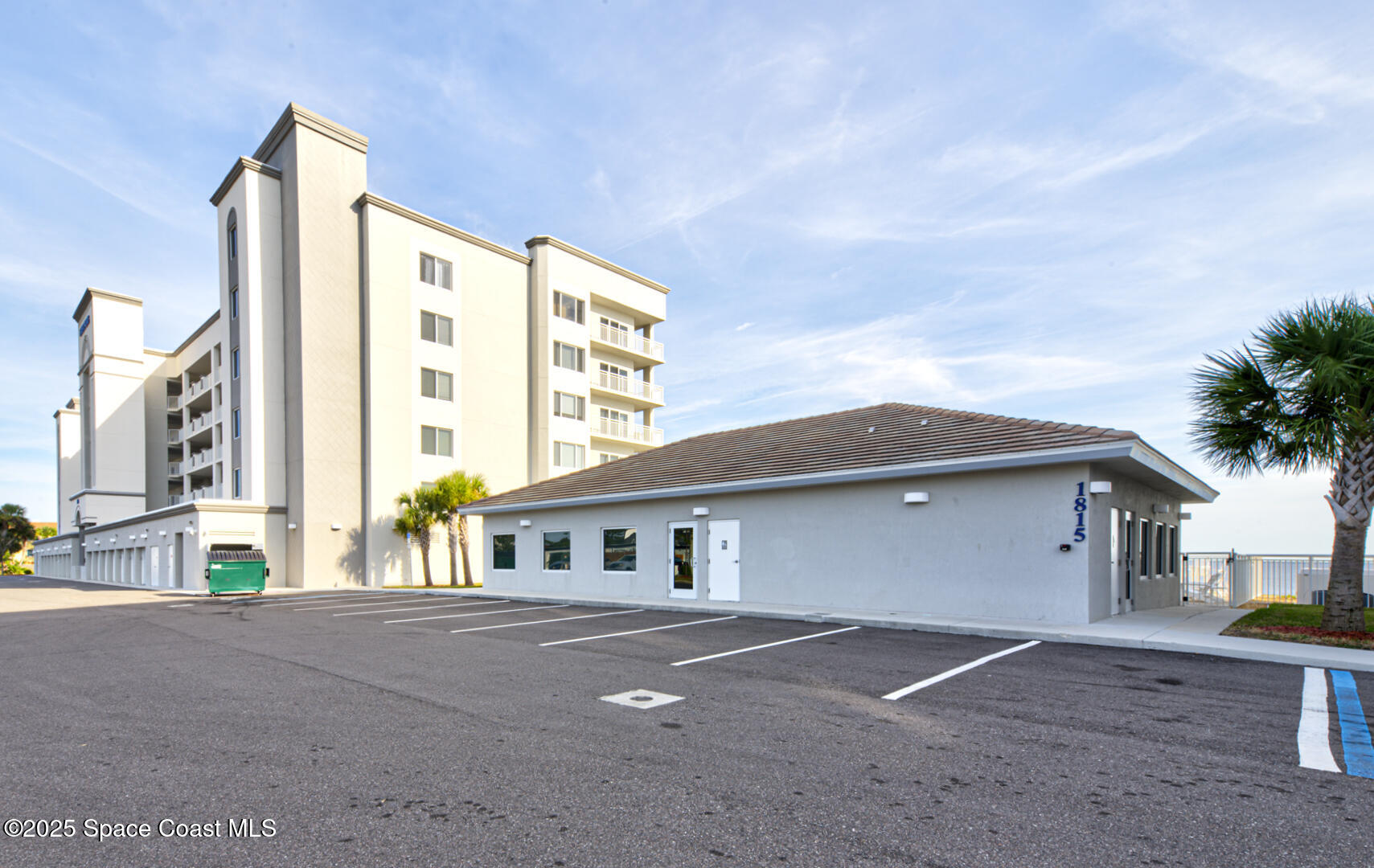 1805 Riverside Drive, Unit 504 Titusville, FL 32780 - Photo 39 of 48 a front view of a house with a yard and garage