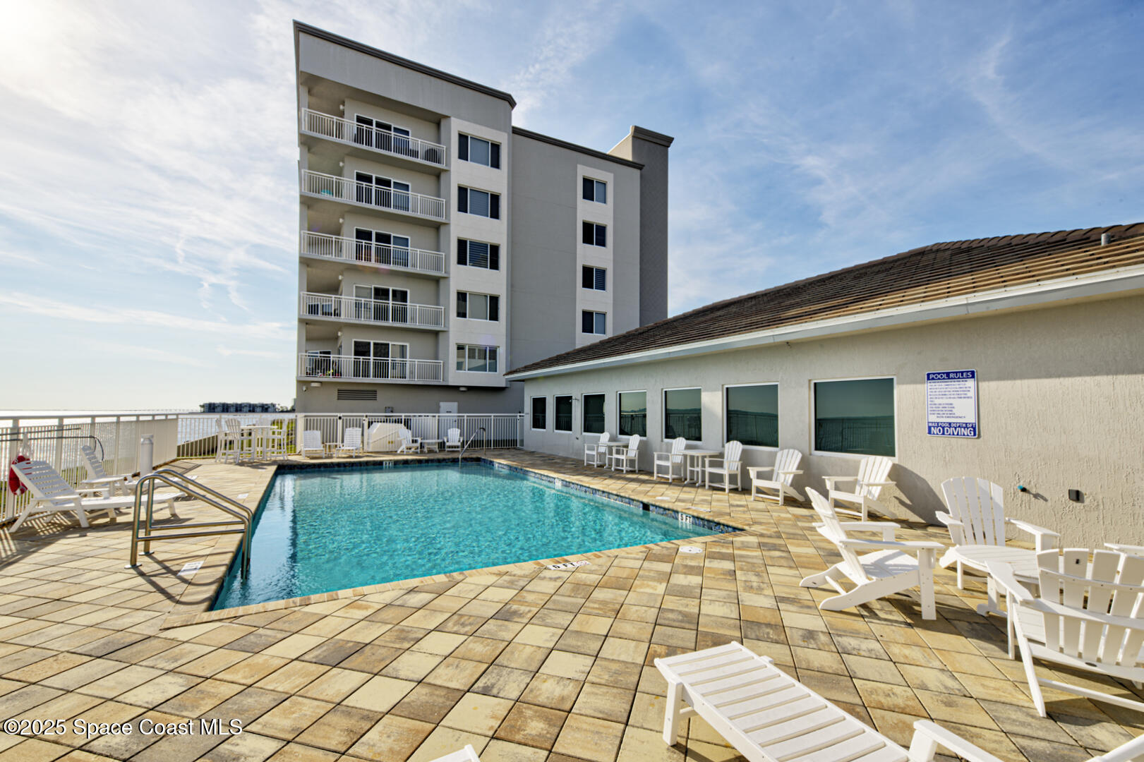 1805 Riverside Drive, Unit 504 Titusville, FL 32780 - Photo 40 of 48 a view of a patio with chairs and plants