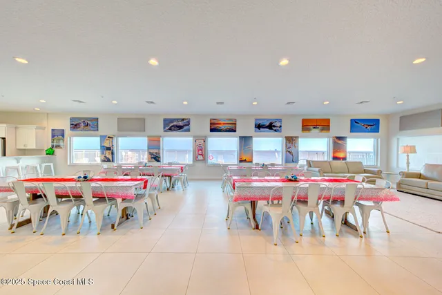 a living room with lots of furniture and a dining table