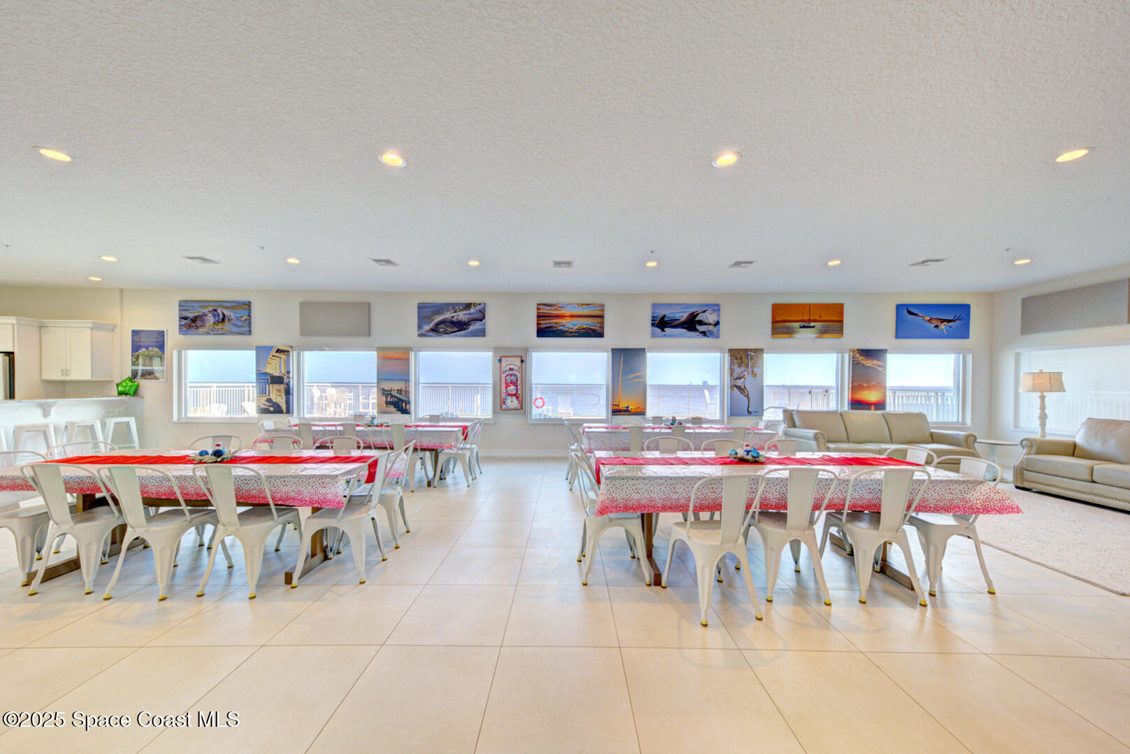 1805 Riverside Drive, Unit 504 Titusville, FL 32780 - Photo 44 of 48 a living room with lots of furniture and a dining table