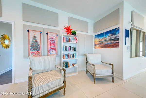 a bedroom with furniture and a baby crib
