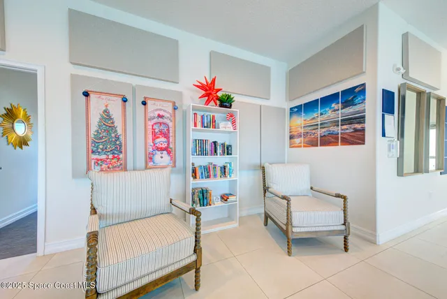 a bedroom with furniture and a baby crib