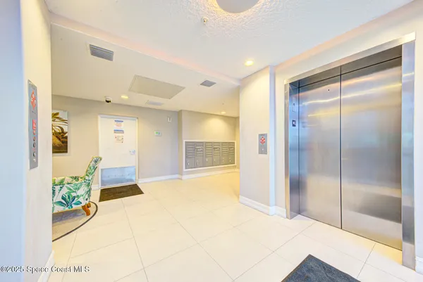 a spacious bathroom with a glass shower door and a bathtub