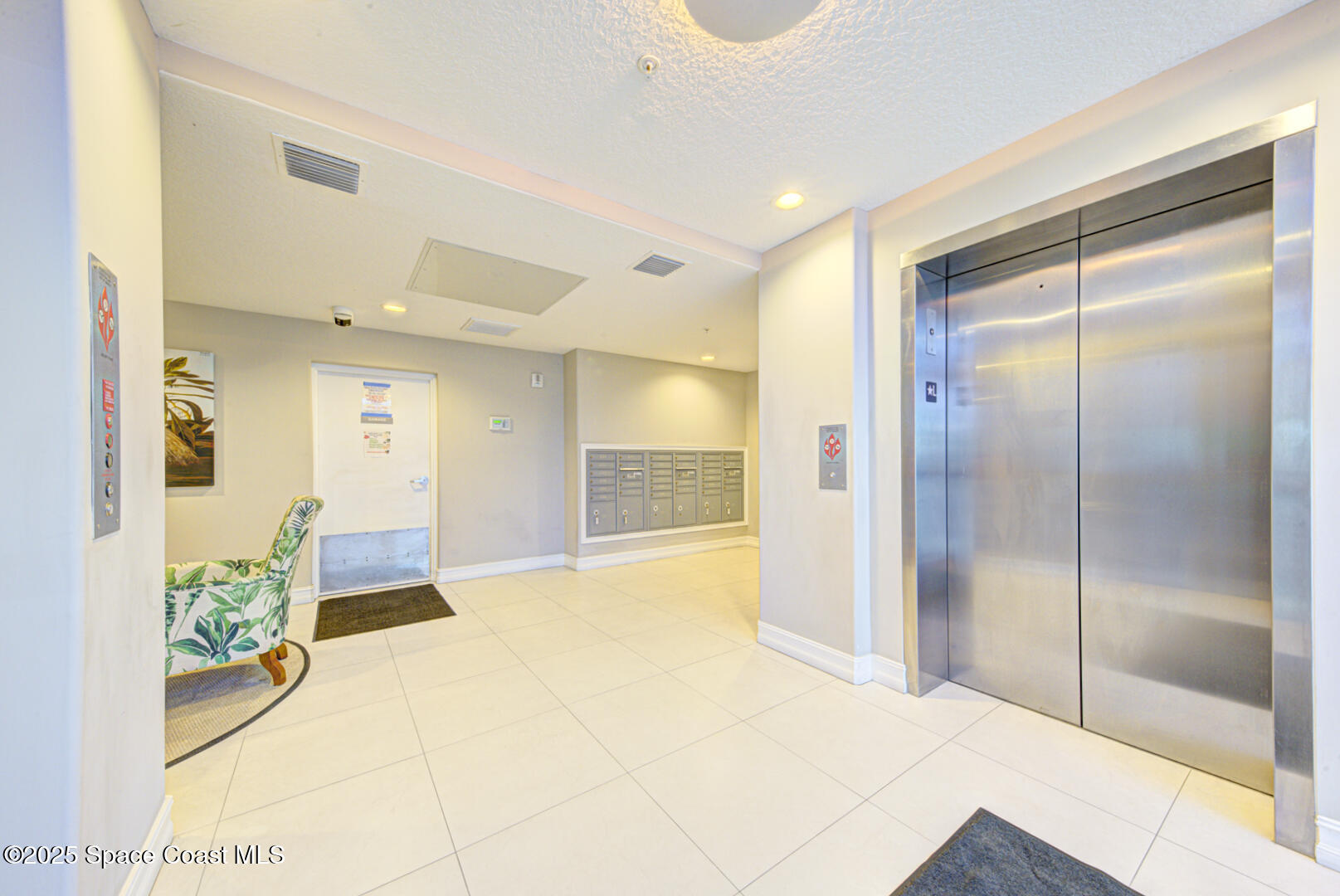1805 Riverside Drive, Unit 504 Titusville, FL 32780 - Photo 5 of 48 a spacious bathroom with a glass shower door and a bathtub