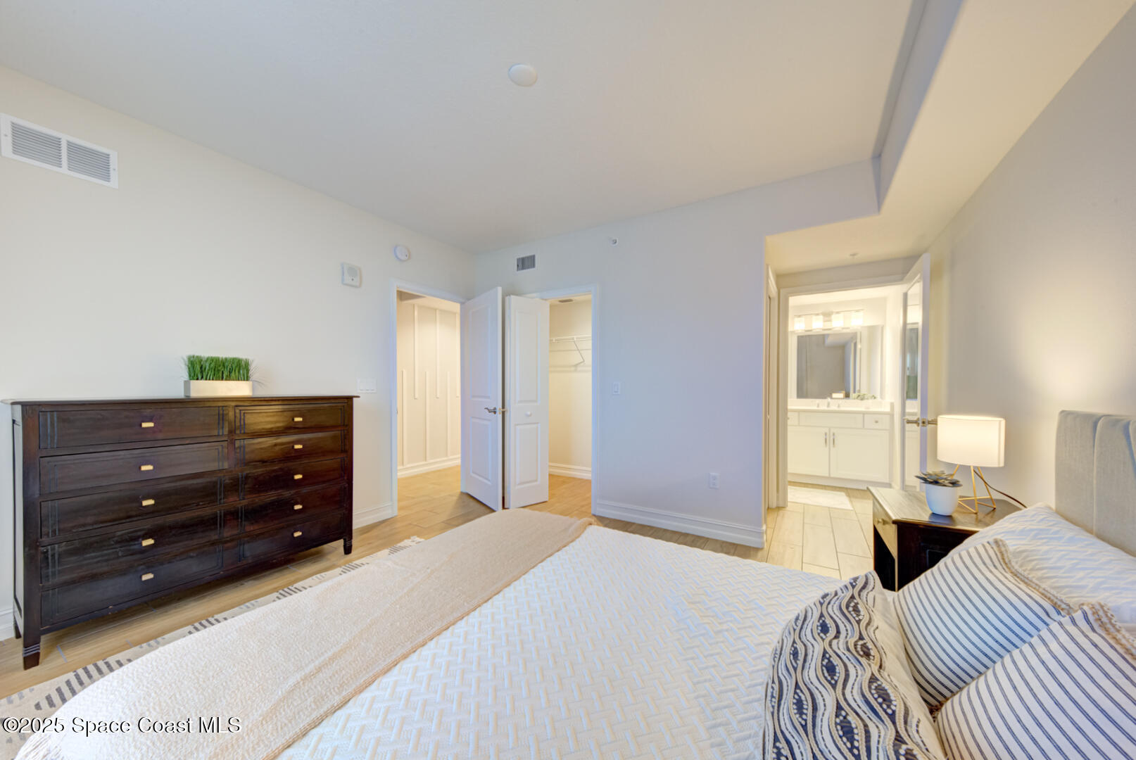 1805 Riverside Drive, Unit 504 Titusville, FL 32780 - Photo 9 of 48 a bedroom with a bed and a window