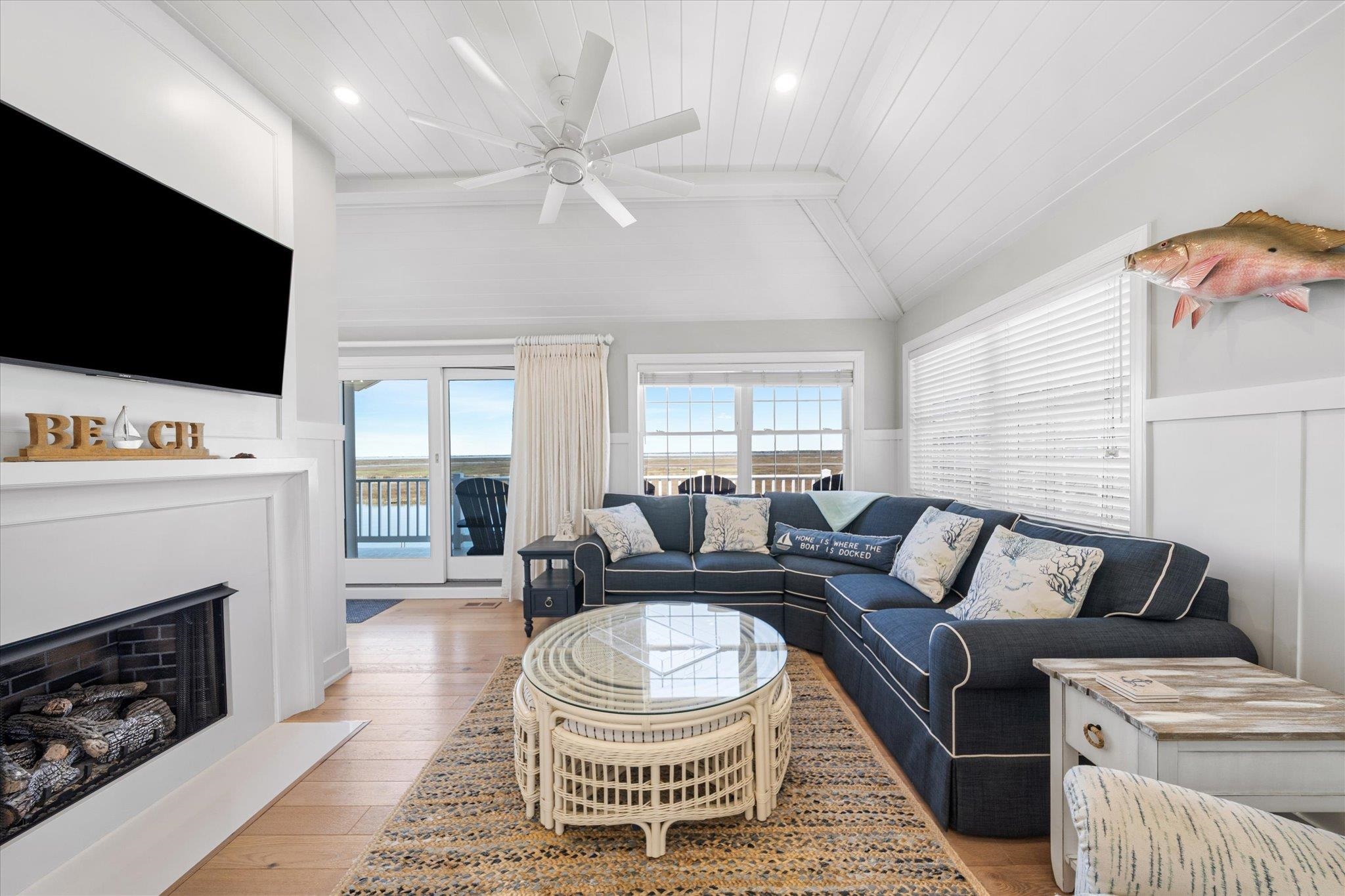 11 Leonard's Lane Avalon, NJ 08202 - Photo 11 of 34 a living room with furniture a flat screen tv and a fireplace