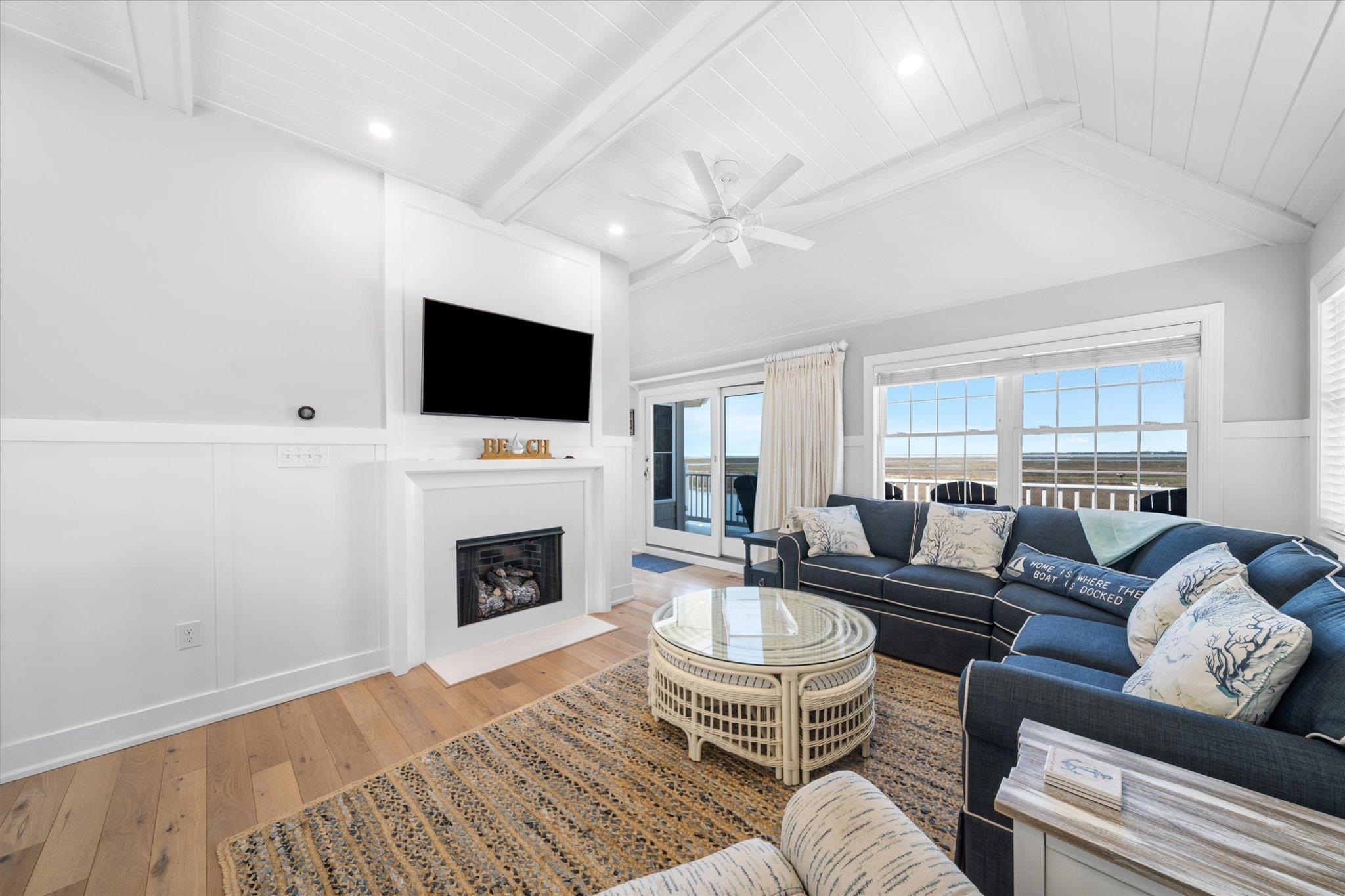 11 Leonard's Lane Avalon, NJ 08202 - Photo 13 of 34 a living room with furniture a fireplace and a flat screen tv