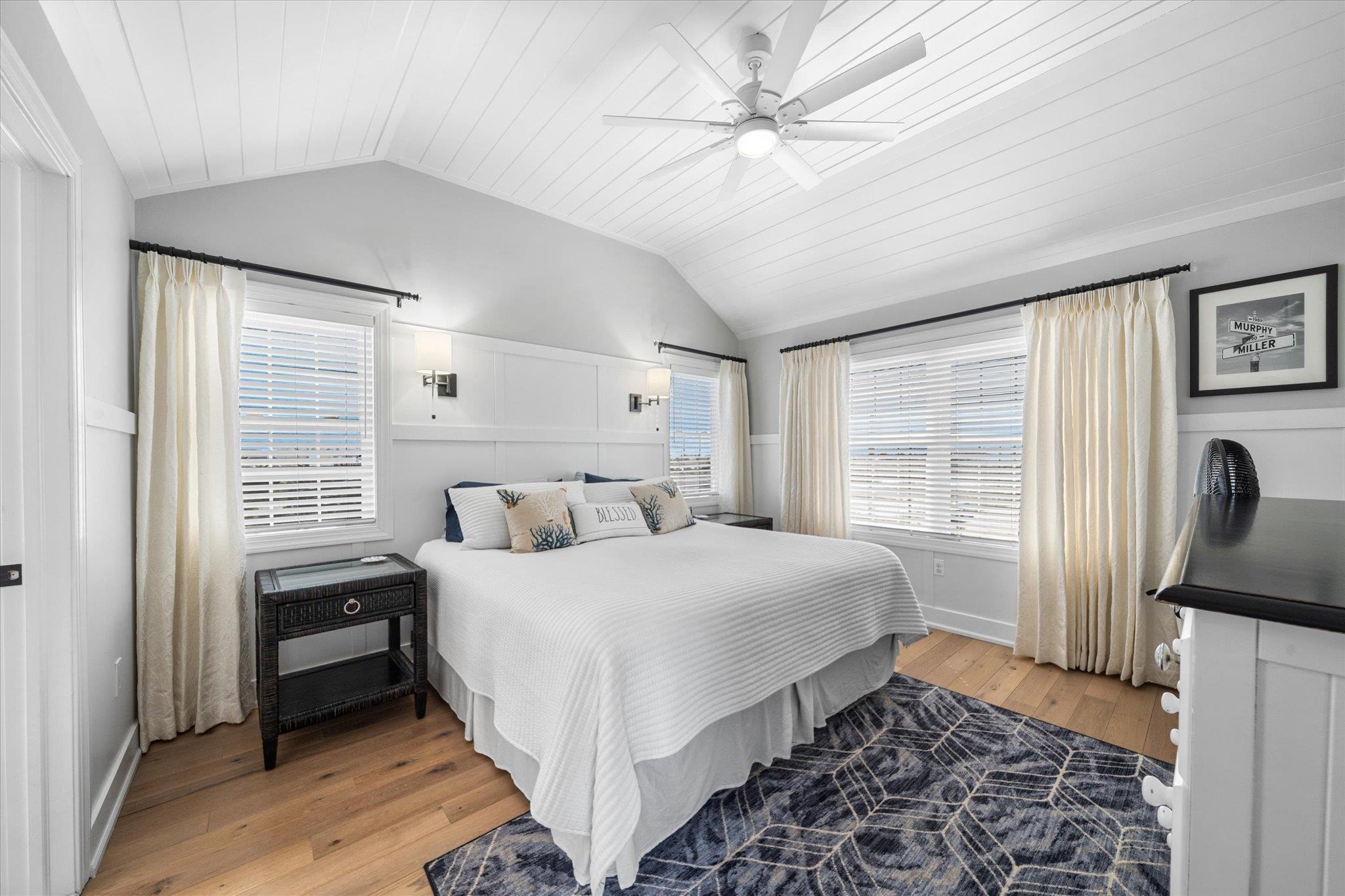 11 Leonard's Lane Avalon, NJ 08202 - Photo 20 of 34 a bedroom with a bed next to a window with a flat tv screen and a dresser