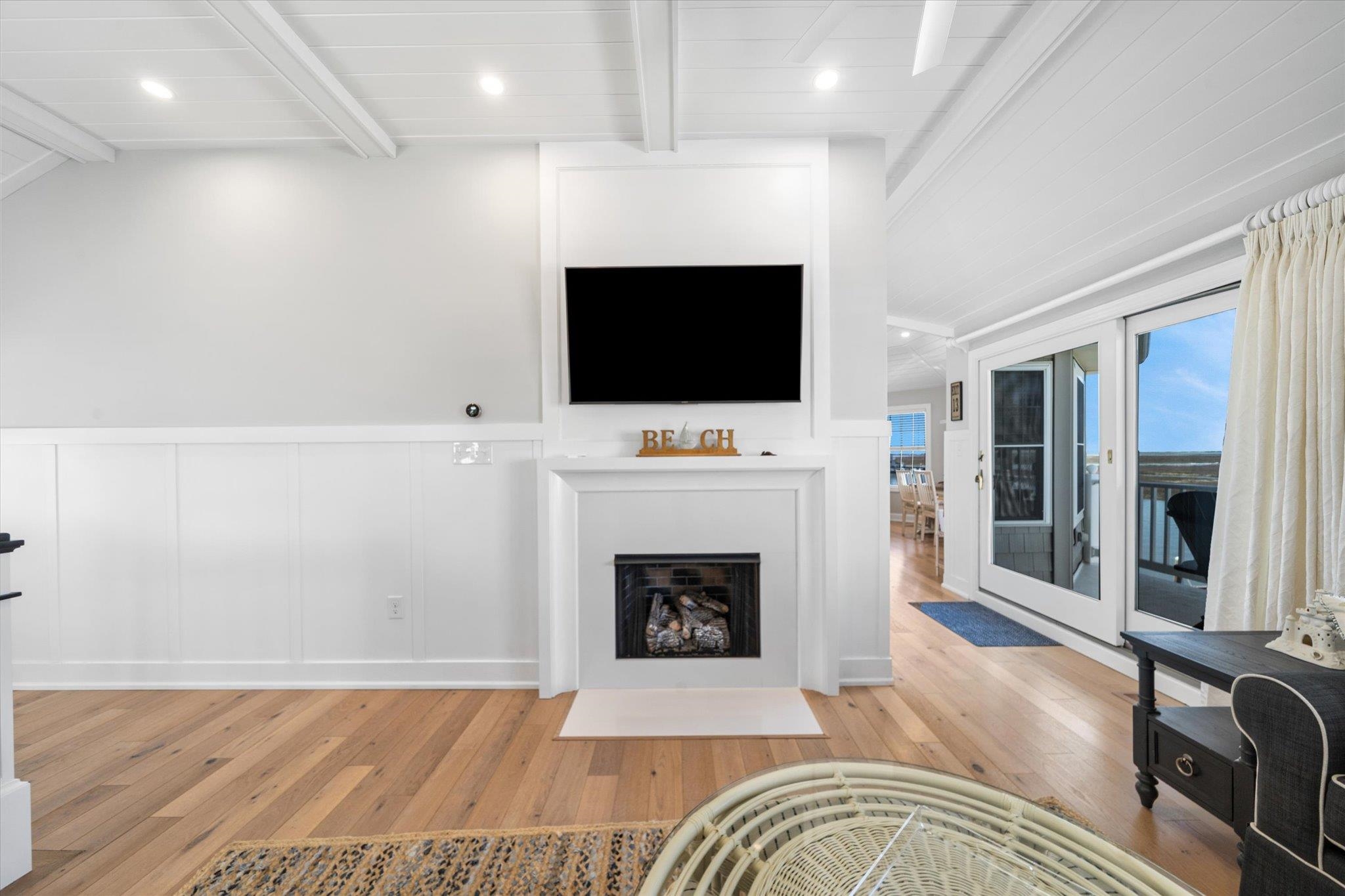 11 Leonard's Lane Avalon, NJ 08202 - Photo 28 of 34 a living room with a fireplace furniture and a flat screen tv