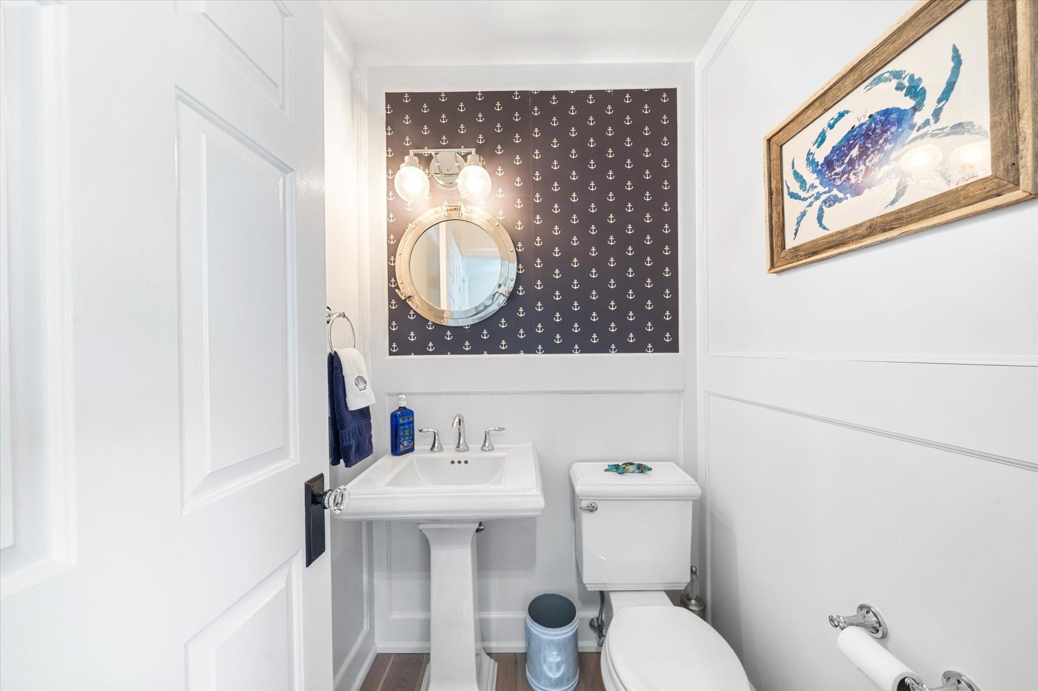 11 Leonard's Lane Avalon, NJ 08202 - Photo 3 of 34 a bathroom with a toilet sink and mirror