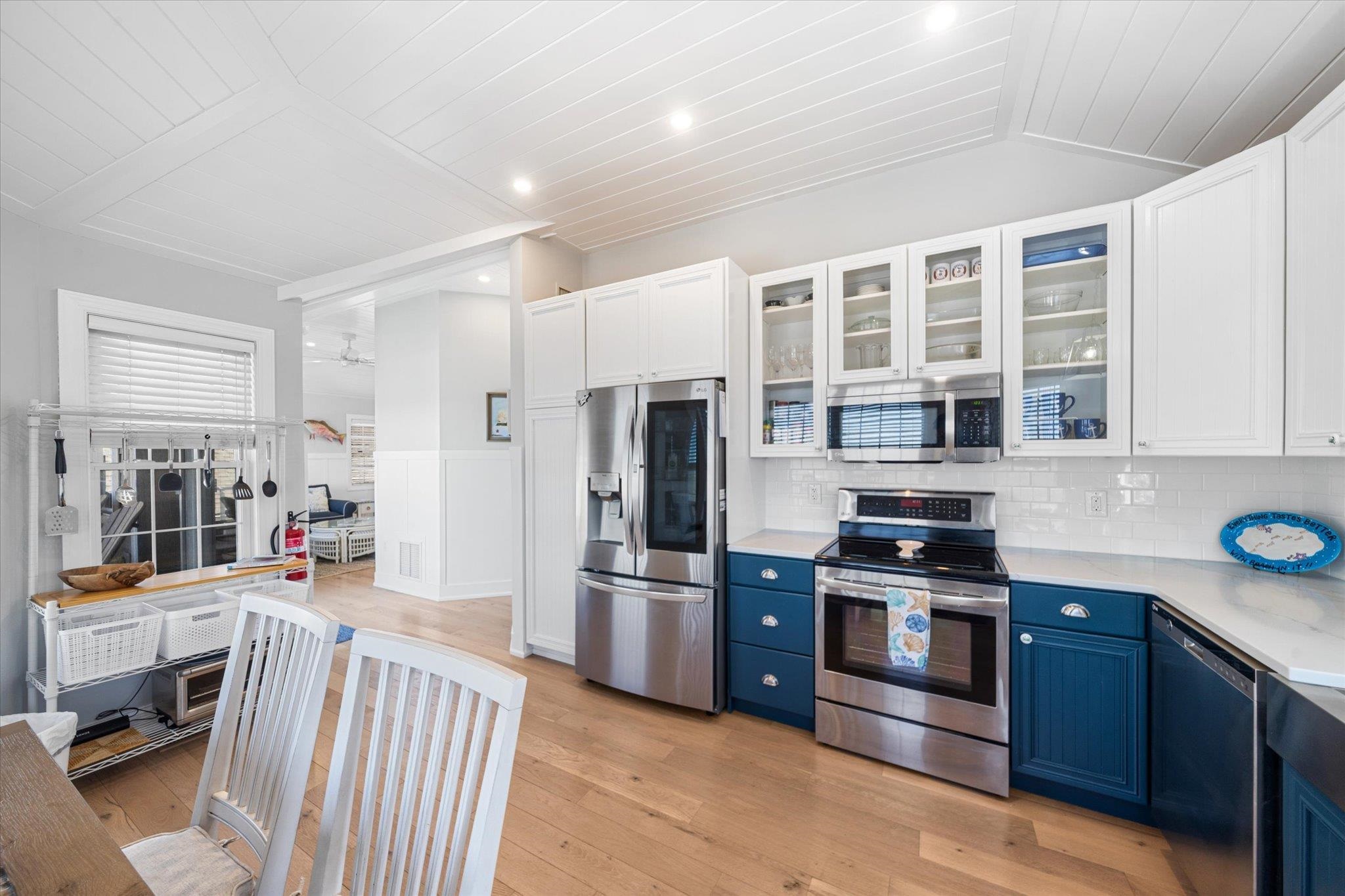 11 Leonard's Lane Avalon, NJ 08202 - Photo 33 of 34 a kitchen with stainless steel appliances granite countertop a refrigerator and a stove top oven
