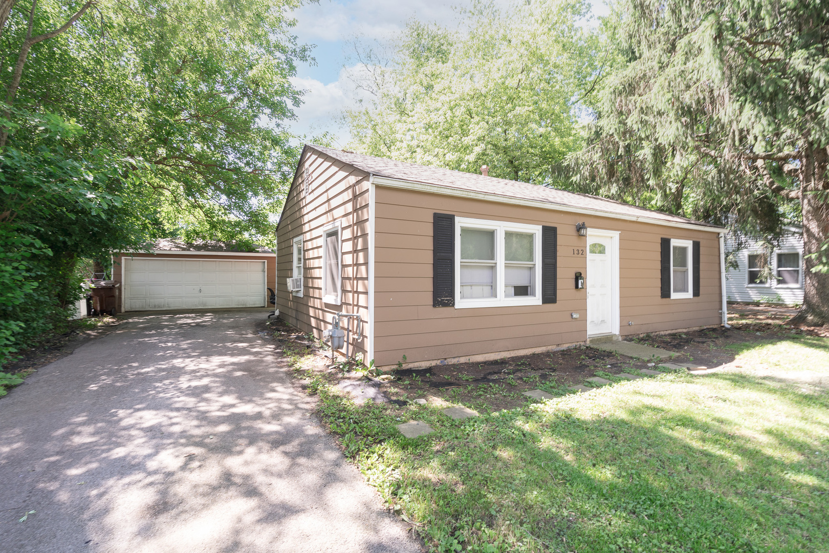 132 Edison Road Joliet, IL 60433 - Photo 1 of 18 a view of a house with a yard and garage