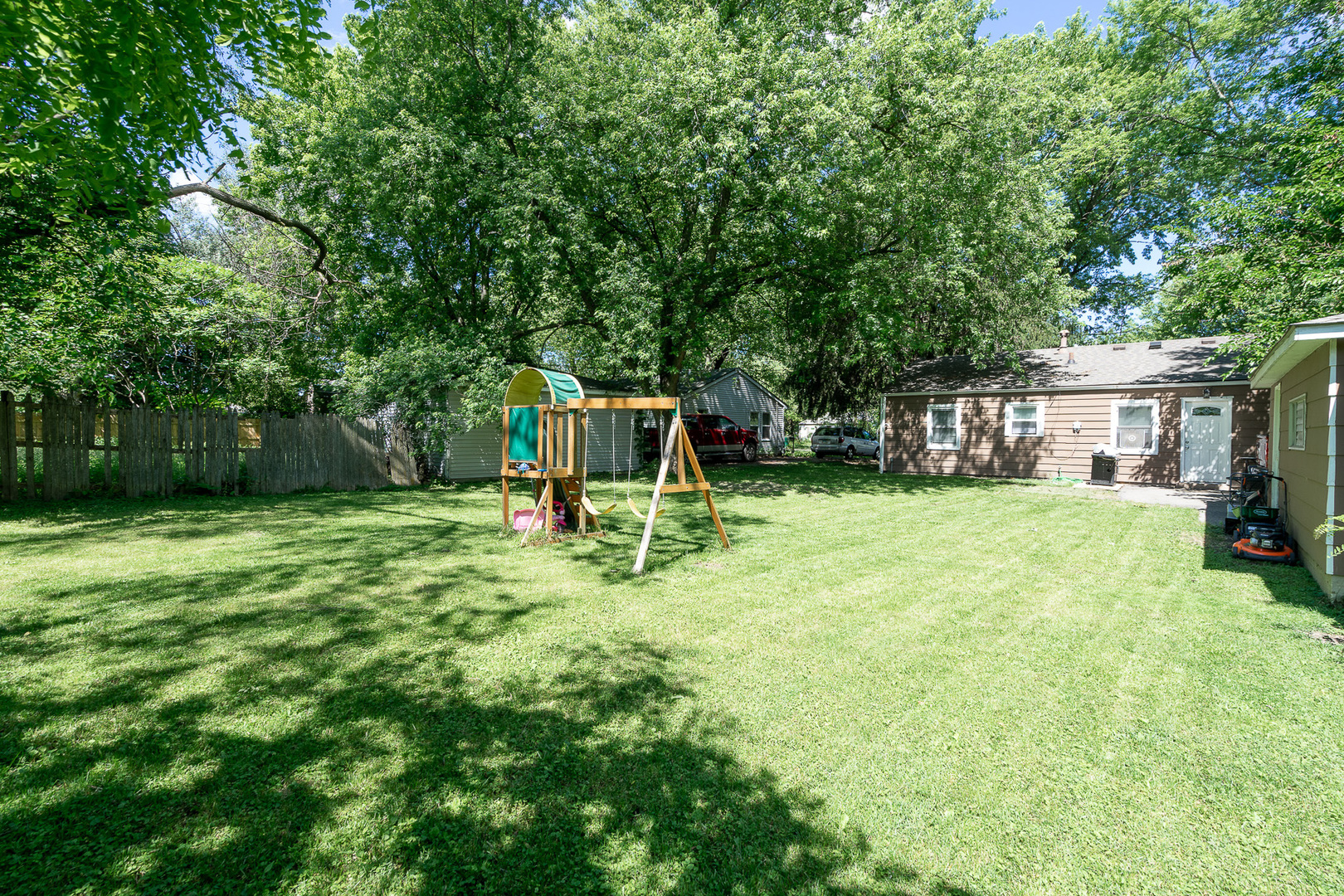 132 Edison Road Joliet, IL 60433 - Photo 12 of 18 a view of a house with backyard and a tree
