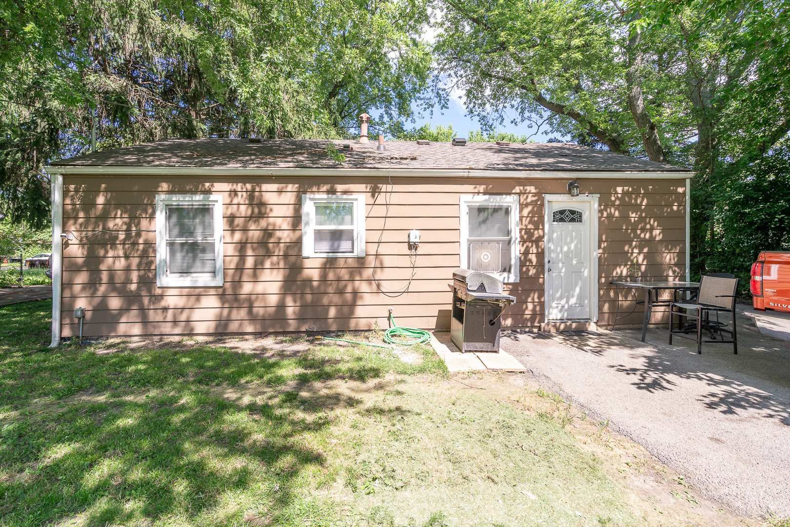 132 Edison Road Joliet, IL 60433 - Photo 18 of 18 a view of backyard with barbeque grill and outdoor seating