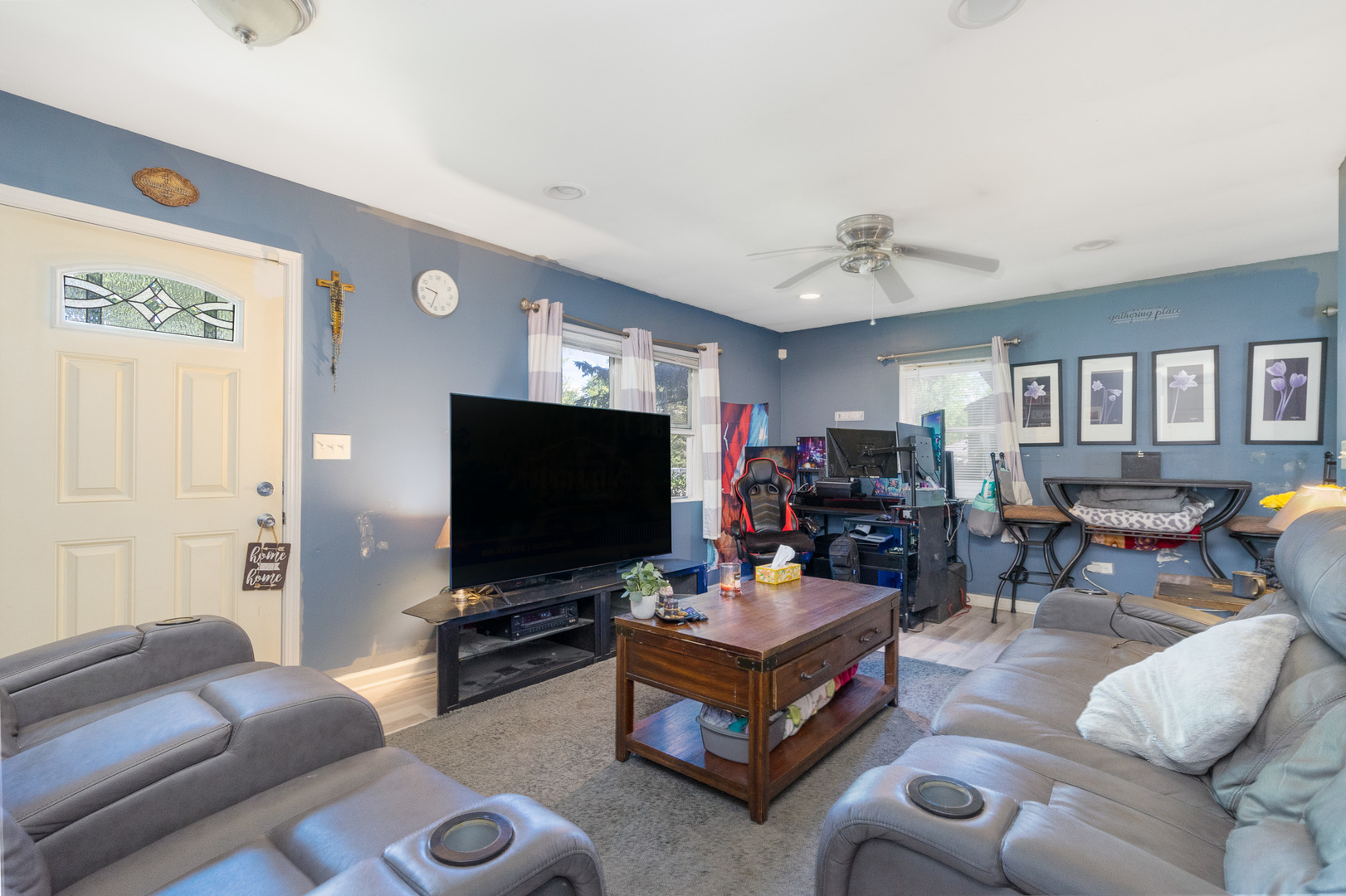 132 Edison Road Joliet, IL 60433 - Photo 3 of 18 a living room with furniture and a flat screen tv