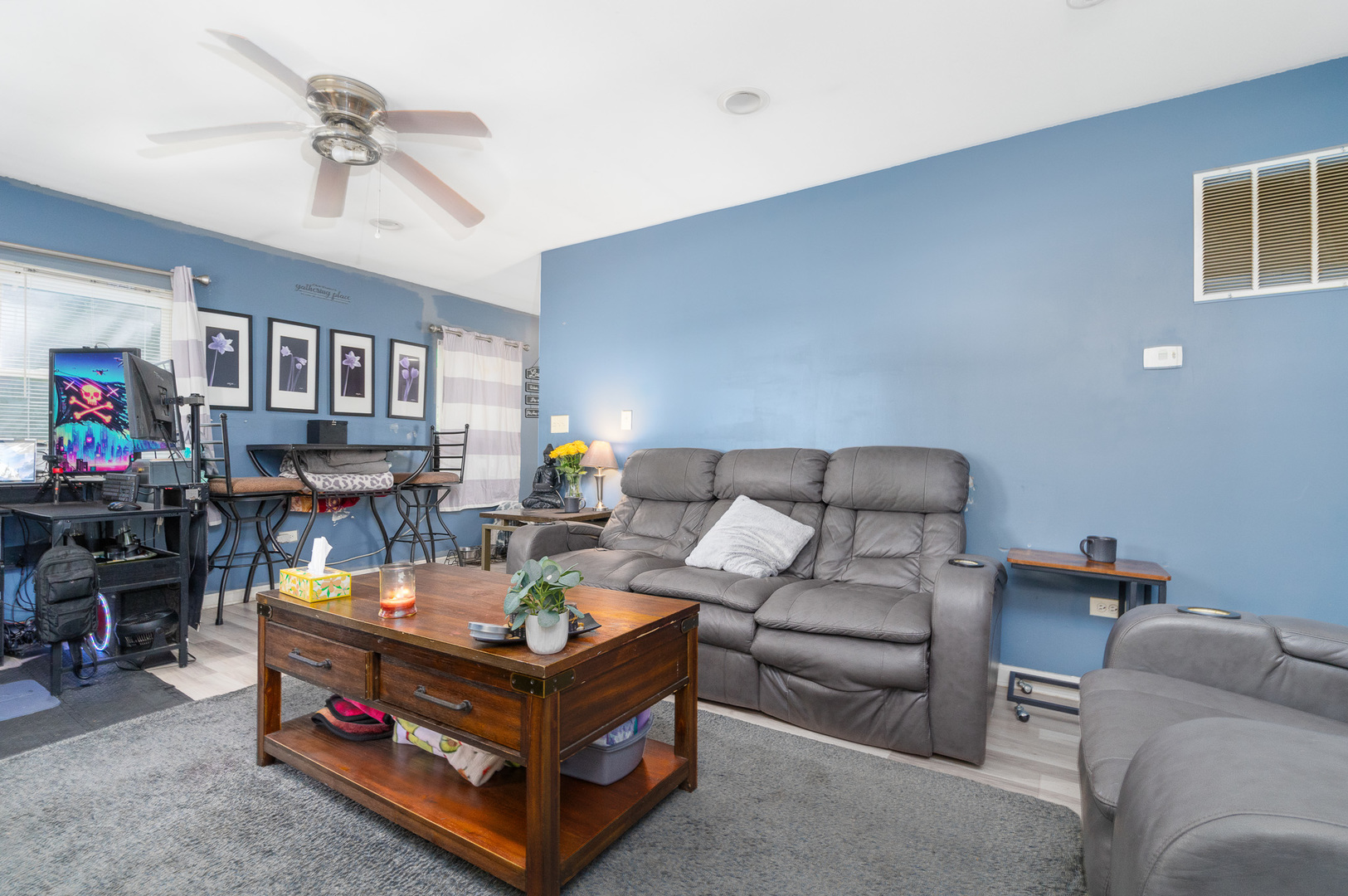 132 Edison Road Joliet, IL 60433 - Photo 4 of 18 a living room with furniture and a chandelier