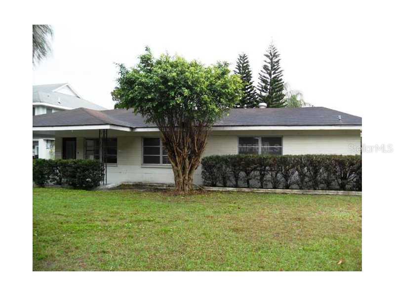 6630 River Road New Port Richey, FL 34652 - Photo 1 of 1 a view of a house with a yard and a porch