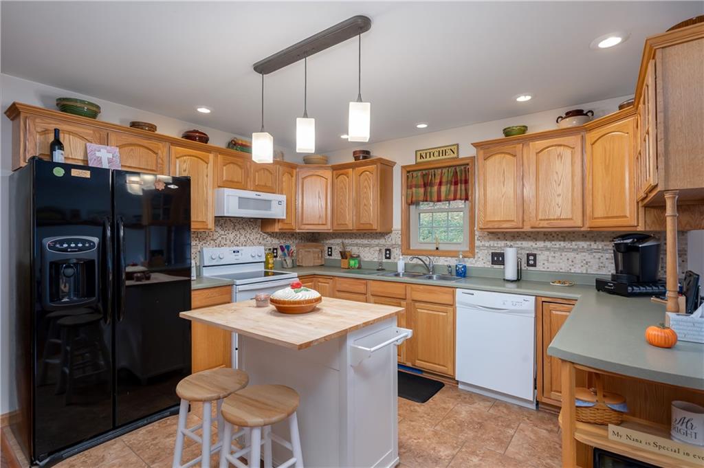 775 Meridian Road Renfrew, PA 16053 - Photo 5 of 25 Lge. Cook's Kichen. Lots of oak wood cabinets with plenty of counterspace. Appliances stay all but refrigerator. Island is negotiable.