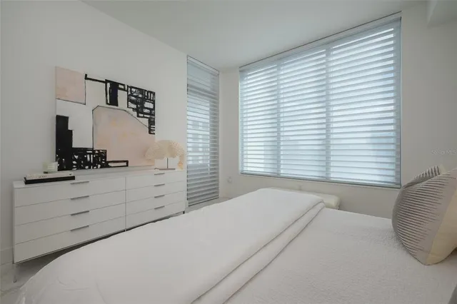 a bathroom with a sink shower and a mirror