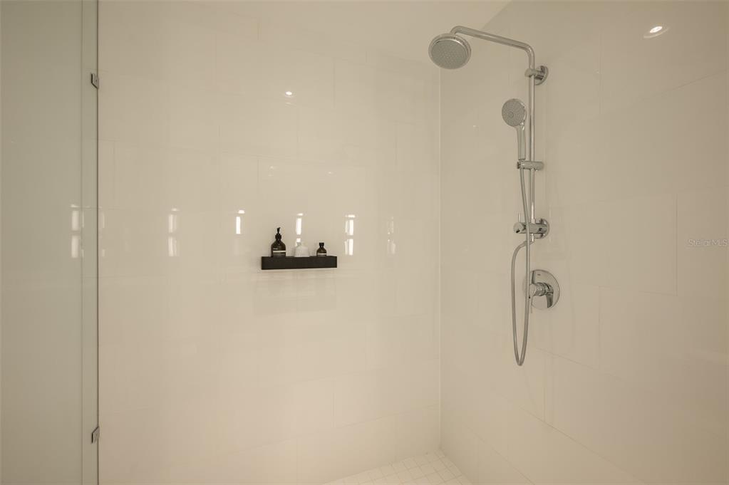 111 South Pineapple Avenue, Unit 1013 Sarasota, FL 34236 - Photo 20 of 62 a bathroom with a shower